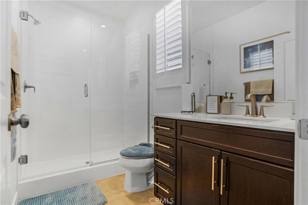 17195 Compass Drive Riverside, CA 92503 - Photo 31 of 75 a bathroom with a sink a toilet and shower