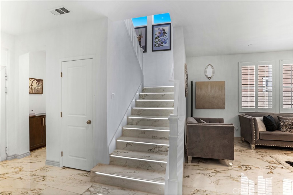 17195 Compass Drive Riverside, CA 92503 - Photo 34 of 75 a view of a livingroom with wooden floor and a ceiling fan