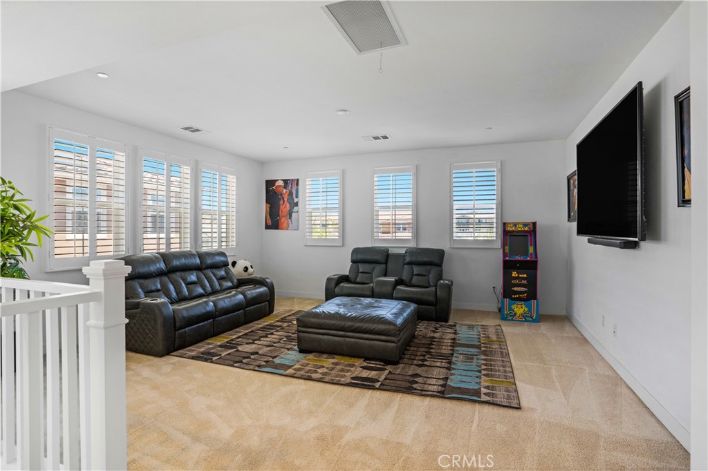 17195 Compass Drive Riverside, CA 92503 - Photo 35 of 75 a living room with furniture and a flat screen tv