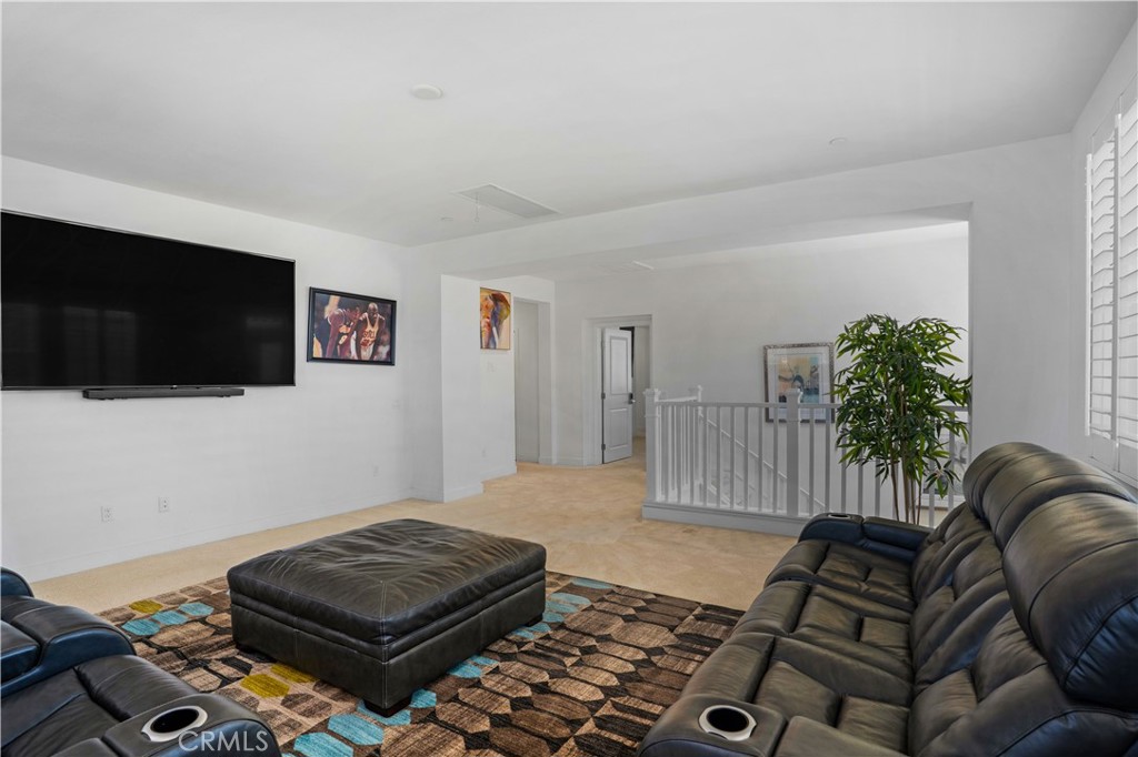 17195 Compass Drive Riverside, CA 92503 - Photo 36 of 75 a living room with furniture and a flat screen tv