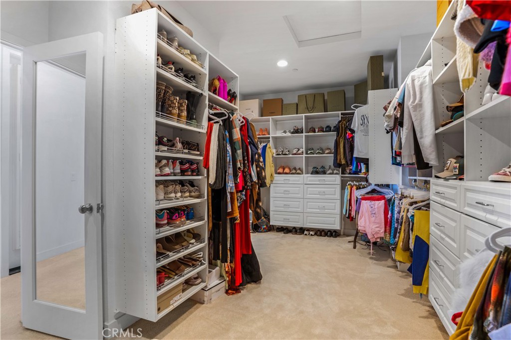 17195 Compass Drive Riverside, CA 92503 - Photo 43 of 75 a view of walk in closet with clothes