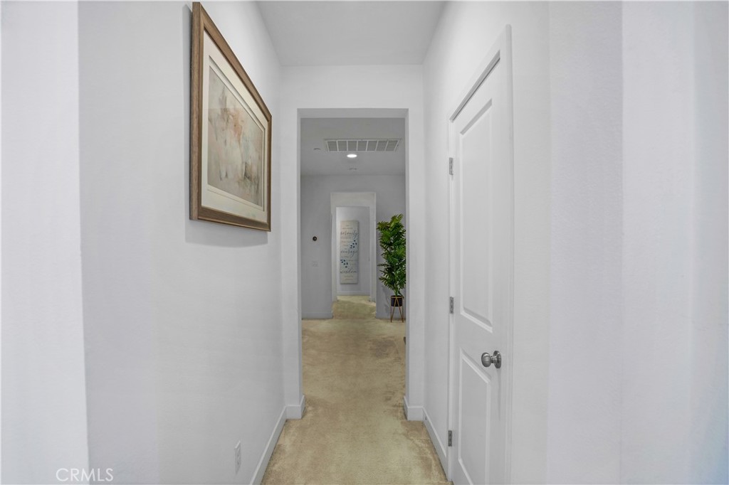 17195 Compass Drive Riverside, CA 92503 - Photo 47 of 75 a view of a hallway with wooden floor and a bathroom