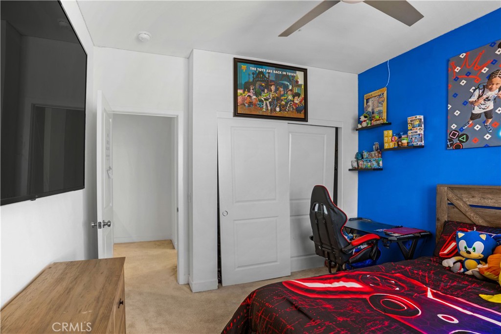 17195 Compass Drive Riverside, CA 92503 - Photo 49 of 75 a bedroom with furniture and a painting on the wall