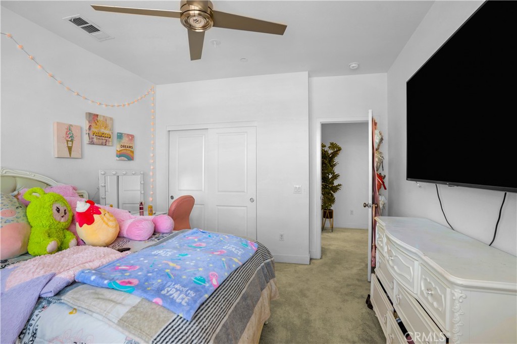 17195 Compass Drive Riverside, CA 92503 - Photo 53 of 75 a bedroom with a bed and flat screen tv