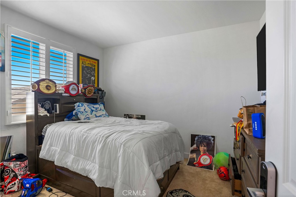 17195 Compass Drive Riverside, CA 92503 - Photo 57 of 75 a bedroom with a bed and a window