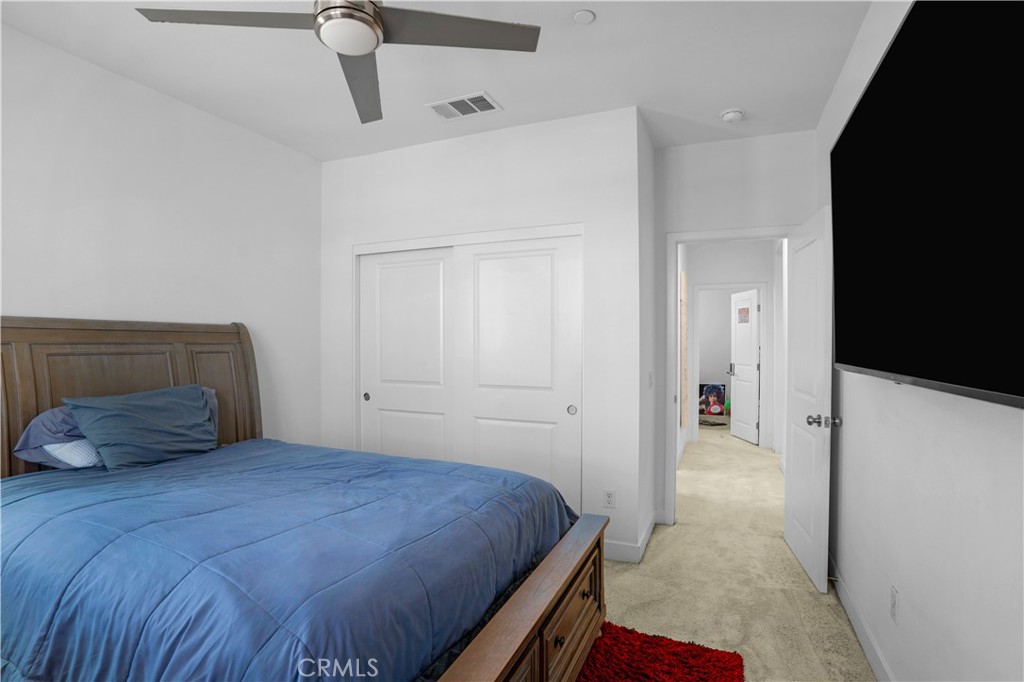 17195 Compass Drive Riverside, CA 92503 - Photo 59 of 75 a bedroom with a bed and a potted plant