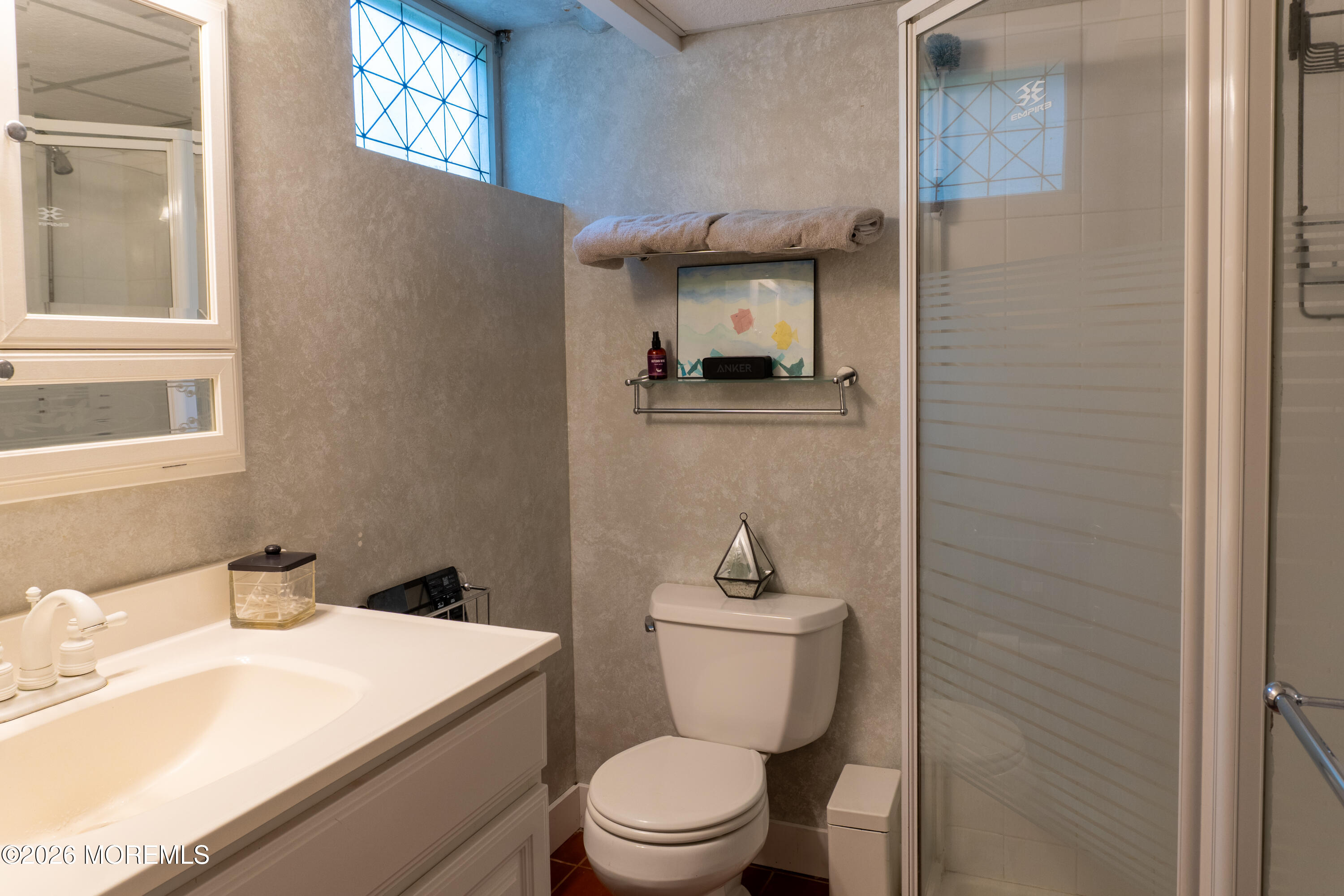 55 Toms River Road Jackson, NJ 08527 - Photo 22 of 31 a bathroom with a toilet a sink and a window