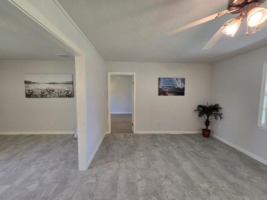 11315 Langdon Lane Houston, TX 77072 - Photo 18 of 40 Family Room looking towards Primary Bedroom entrance
