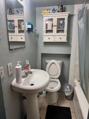 a view of a livingroom with furniture and a window