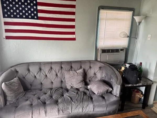 a bed room with a bed and a window