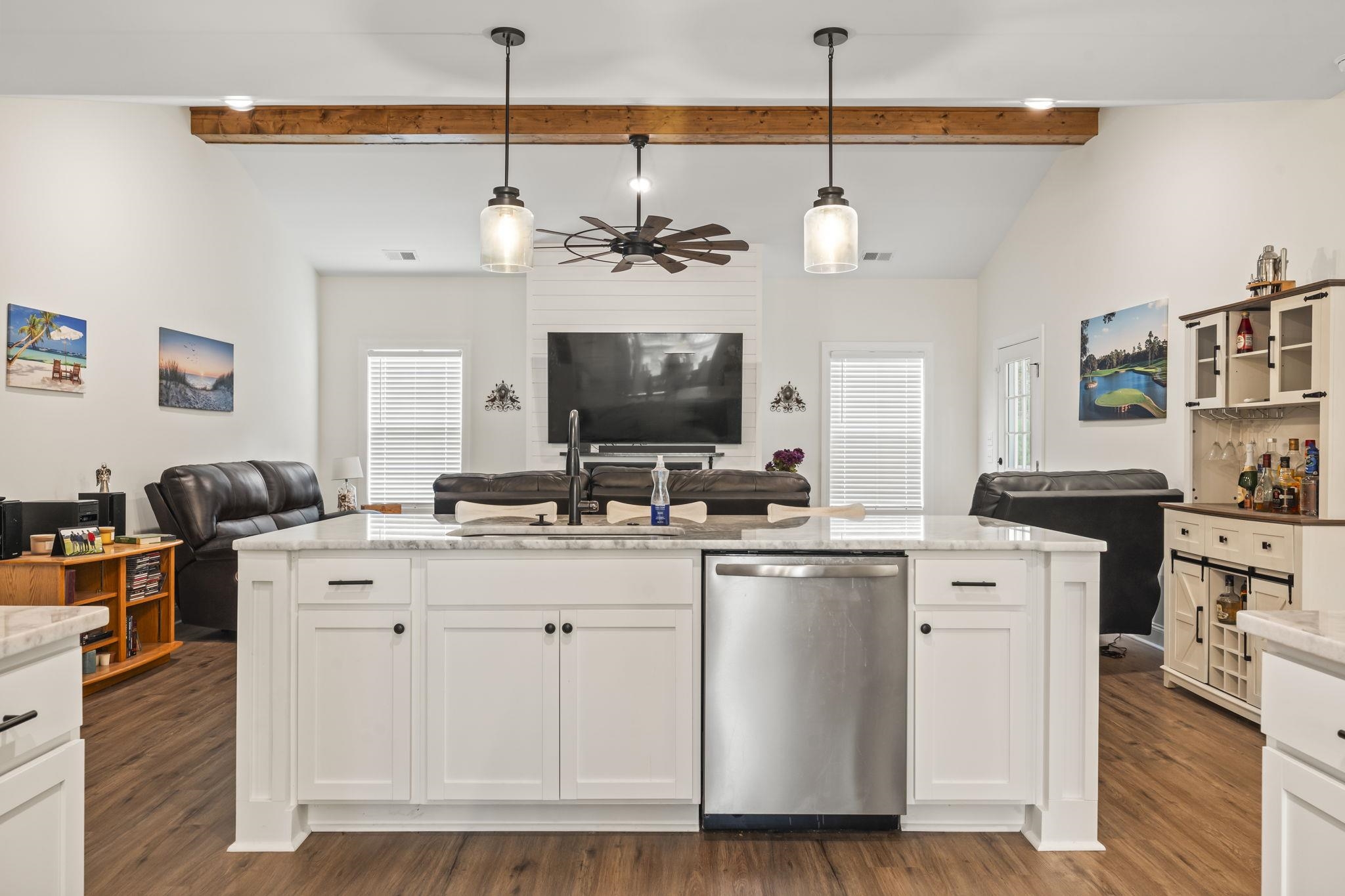 207 Putney Court Conway, SC 29526 - Photo 37 of 38 Kitchen with open floor plan, light stone counters, stainless steel dishwasher, white cabinetry, and high vaulted ceiling