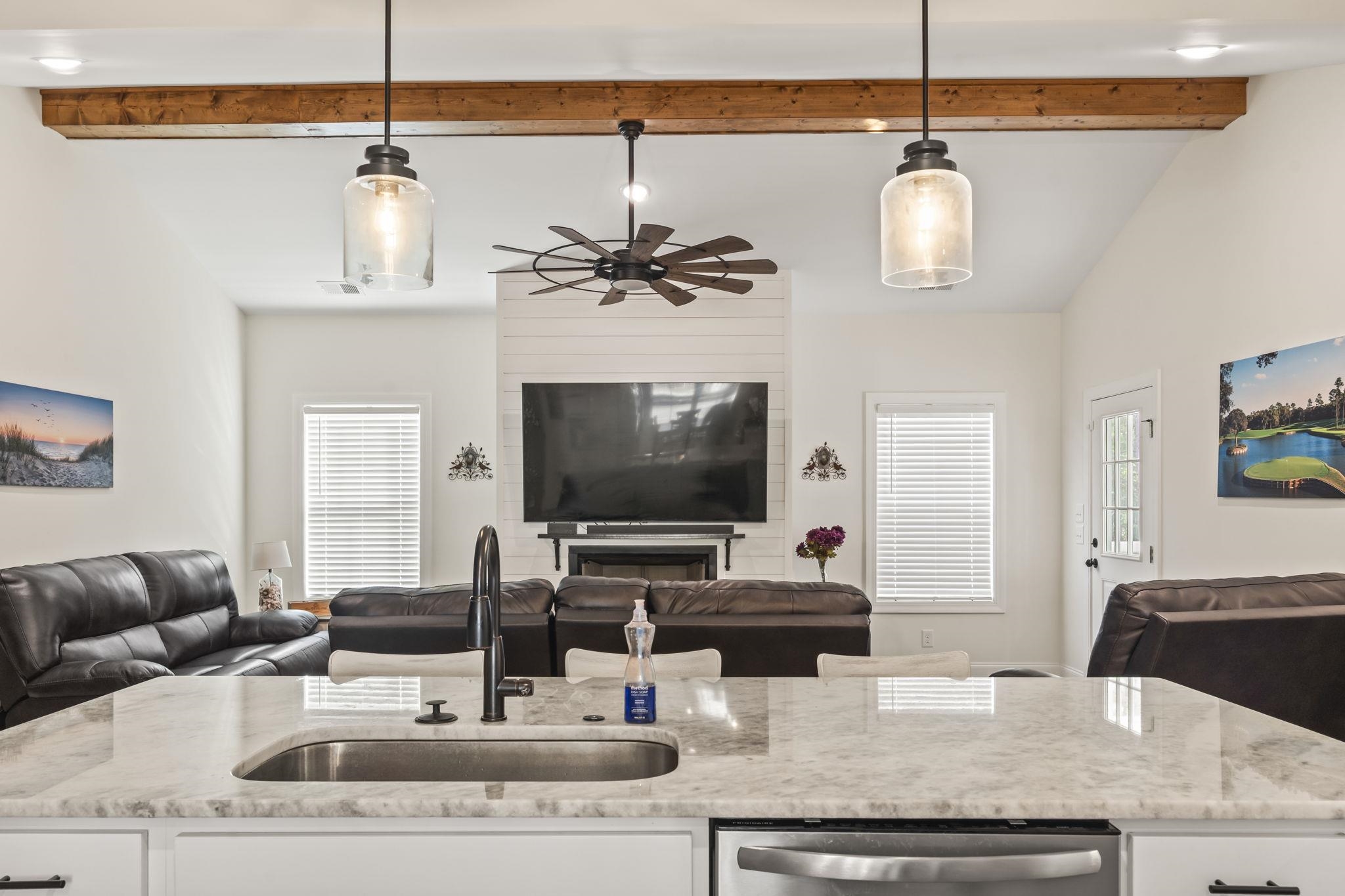 207 Putney Court Conway, SC 29526 - Photo 38 of 38 Kitchen featuring open floor plan, light stone counters, white cabinetry, beamed ceiling, and high vaulted ceiling