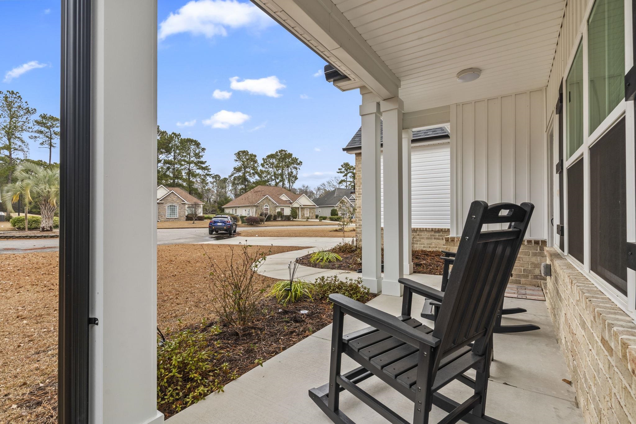 207 Putney Court Conway, SC 29526 - Photo 4 of 38 Porch featuring a residential view