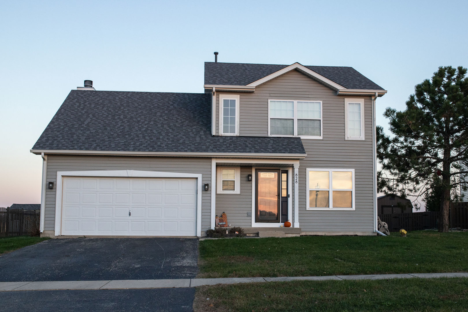 828 Spring Meadow Lane Malta, IL 60150 - Photo 1 of 19 a front view of a house with a yard