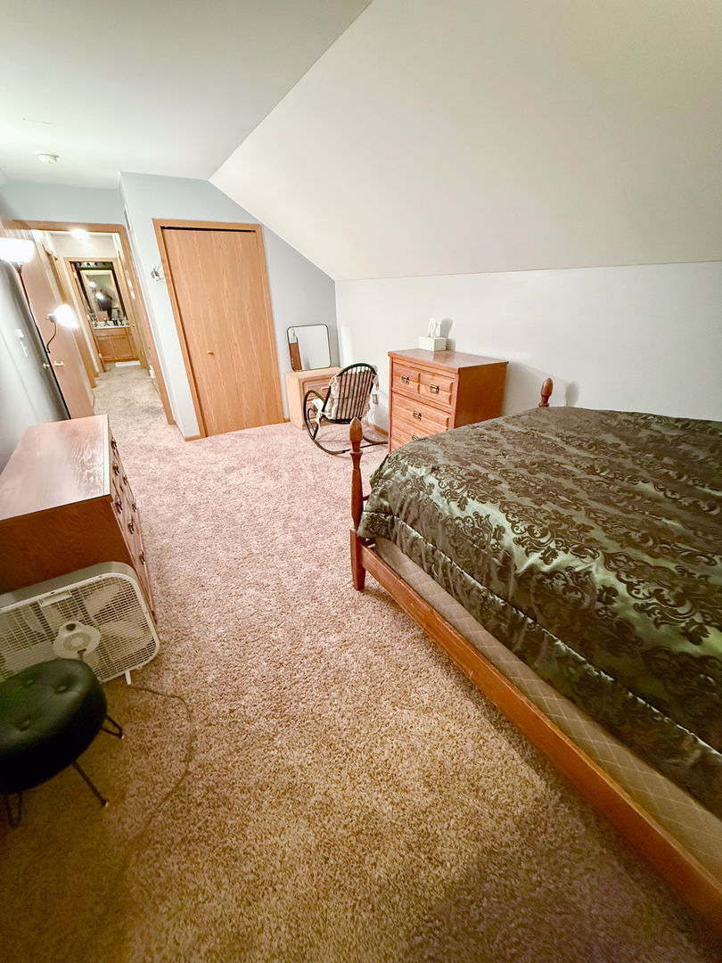 828 Spring Meadow Lane Malta, IL 60150 - Photo 12 of 19 a bed sitting in a bedroom next to a window