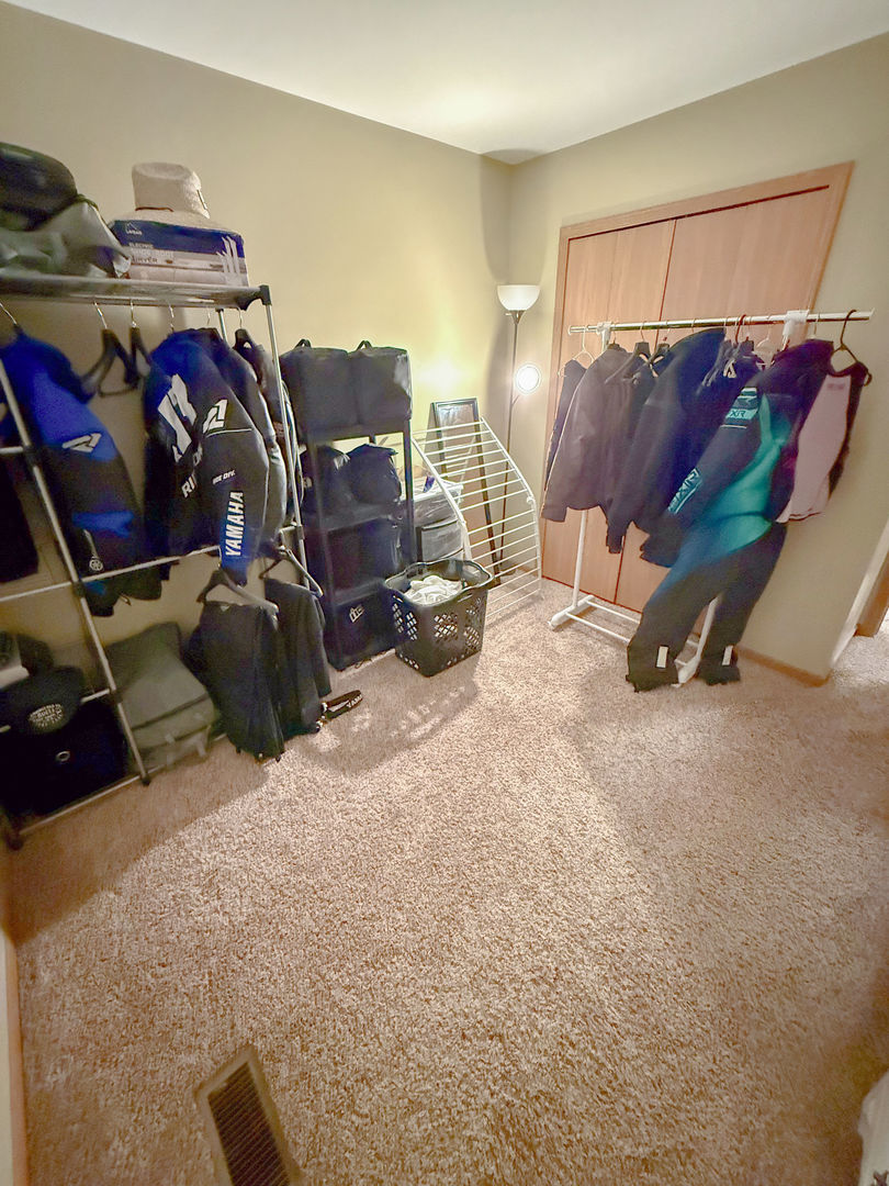 828 Spring Meadow Lane Malta, IL 60150 - Photo 14 of 19 a room with gym equipment and a view of living room