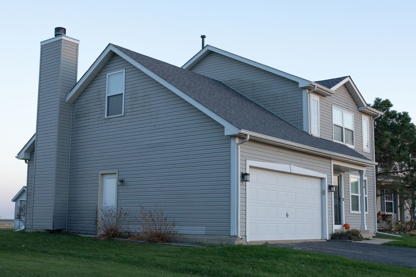 828 Spring Meadow Lane Malta, IL 60150 - Photo 2 of 19 a view of a house with a yard