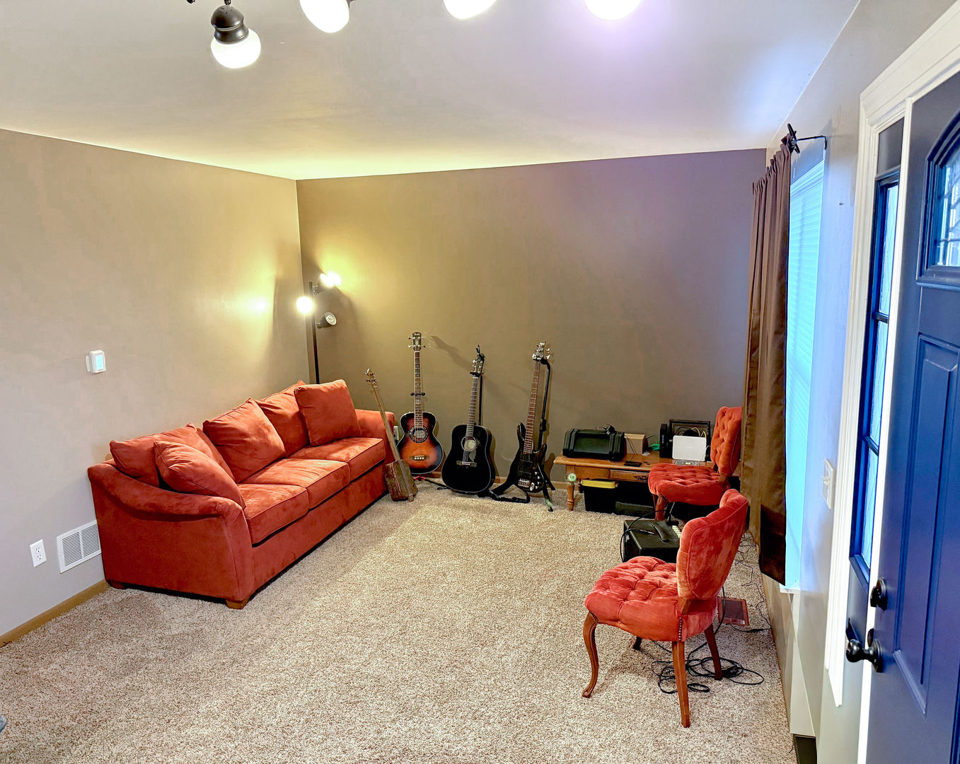 828 Spring Meadow Lane Malta, IL 60150 - Photo 4 of 19 a living room with furniture a rug and a chandelier
