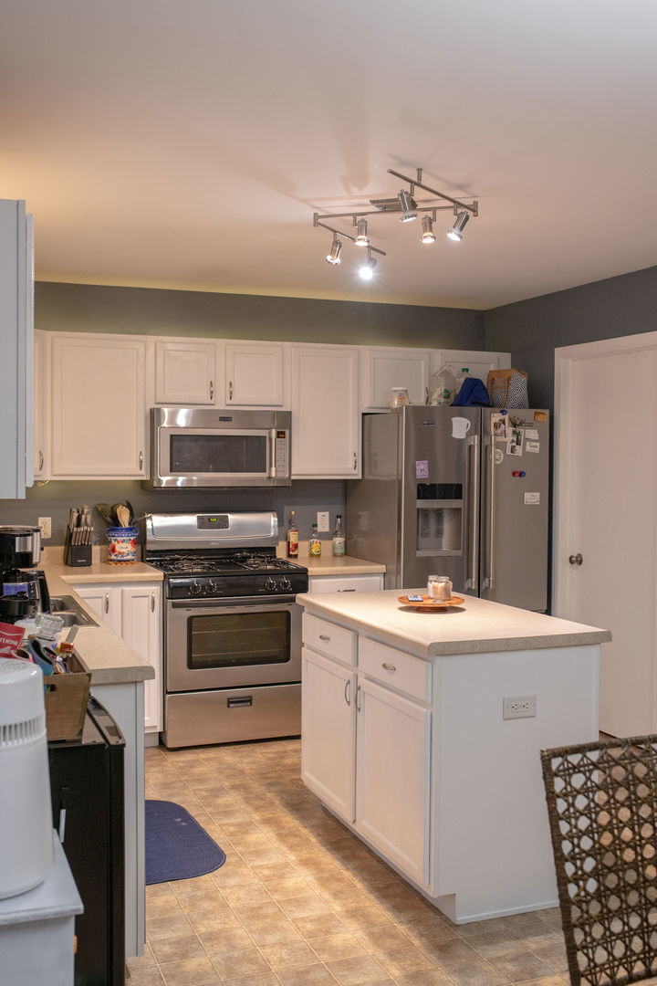 828 Spring Meadow Lane Malta, IL 60150 - Photo 5 of 19 a kitchen with stainless steel appliances kitchen island granite countertop a sink and cabinets