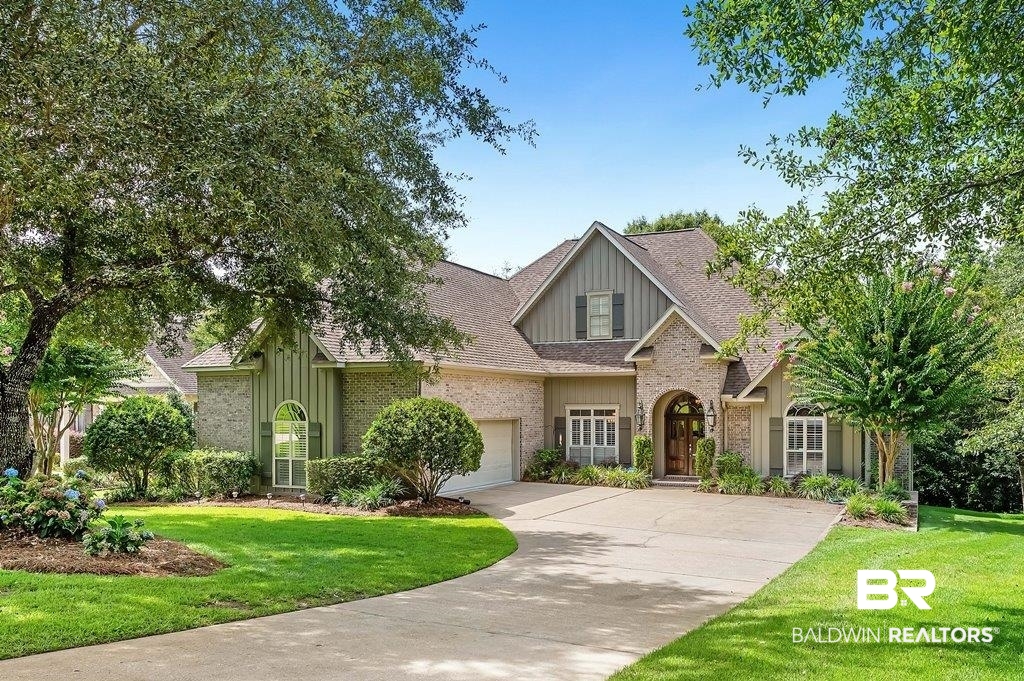 29976 Dolive Ridge Daphne, AL 36527 - Photo 1 of 58 View of front of house featuring a garage and a front lawn