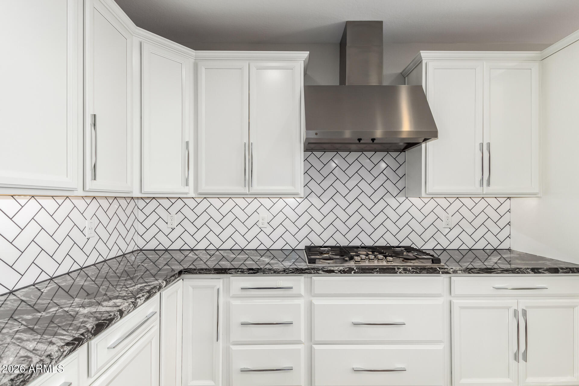 1873 South Follett Way Gilbert, AZ 85295 - Photo 13 of 40 a kitchen with granite countertop white cabinets and a sink