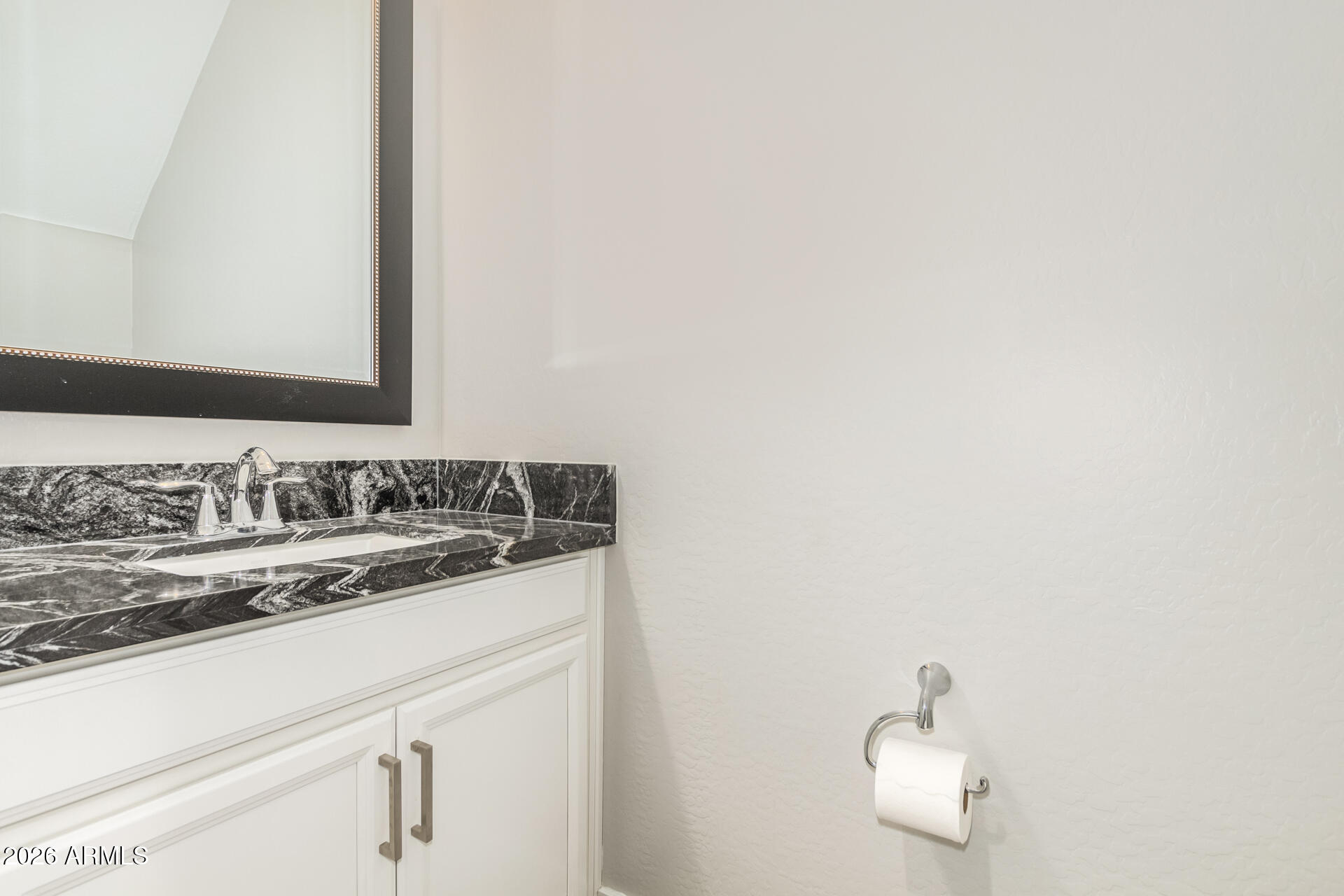 1873 South Follett Way Gilbert, AZ 85295 - Photo 14 of 40 a bathroom with a sink and a mirror