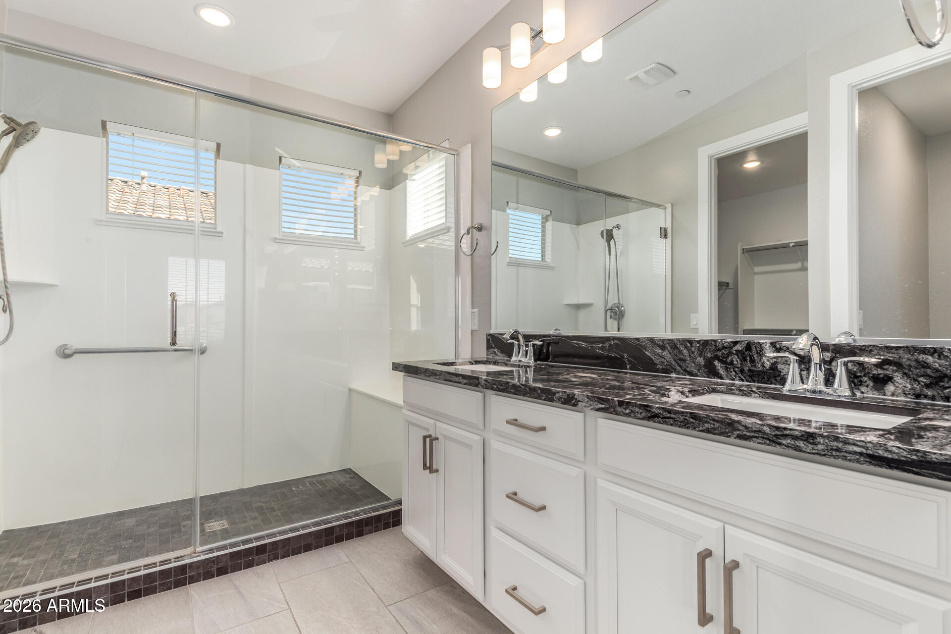 1873 South Follett Way Gilbert, AZ 85295 - Photo 20 of 40 a bathroom with double sink and a mirror