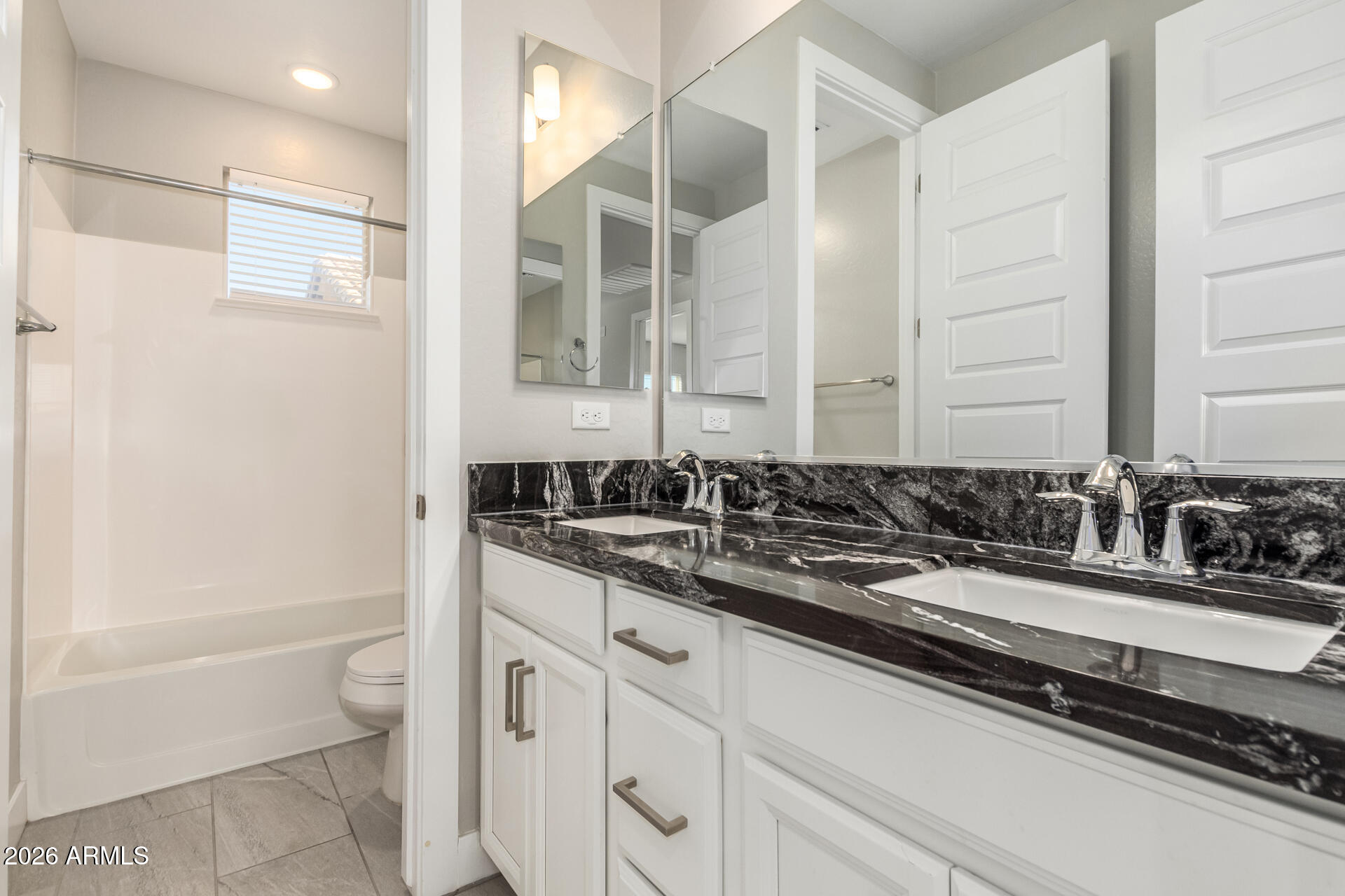 1873 South Follett Way Gilbert, AZ 85295 - Photo 26 of 40 a bathroom with a sink and a mirror