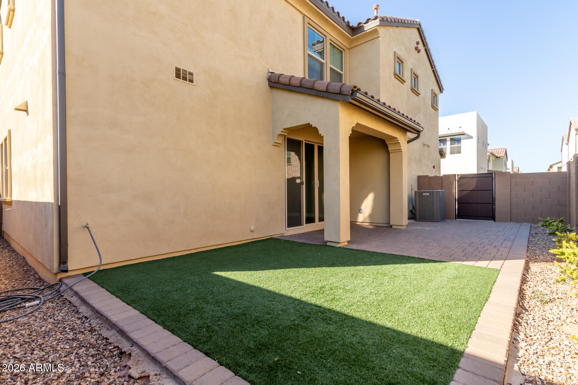 1873 South Follett Way Gilbert, AZ 85295 - Photo 30 of 40 a front view of a house with a yard