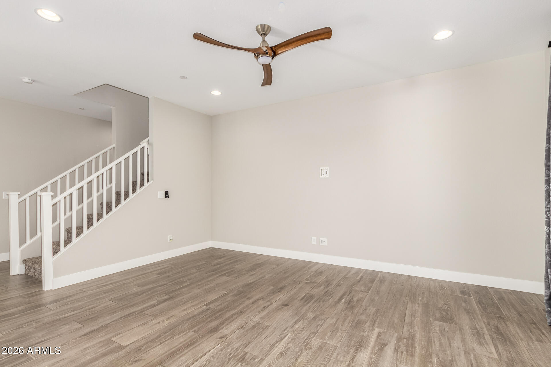 1873 South Follett Way Gilbert, AZ 85295 - Photo 5 of 40 a view of a room with wooden floor and white walls