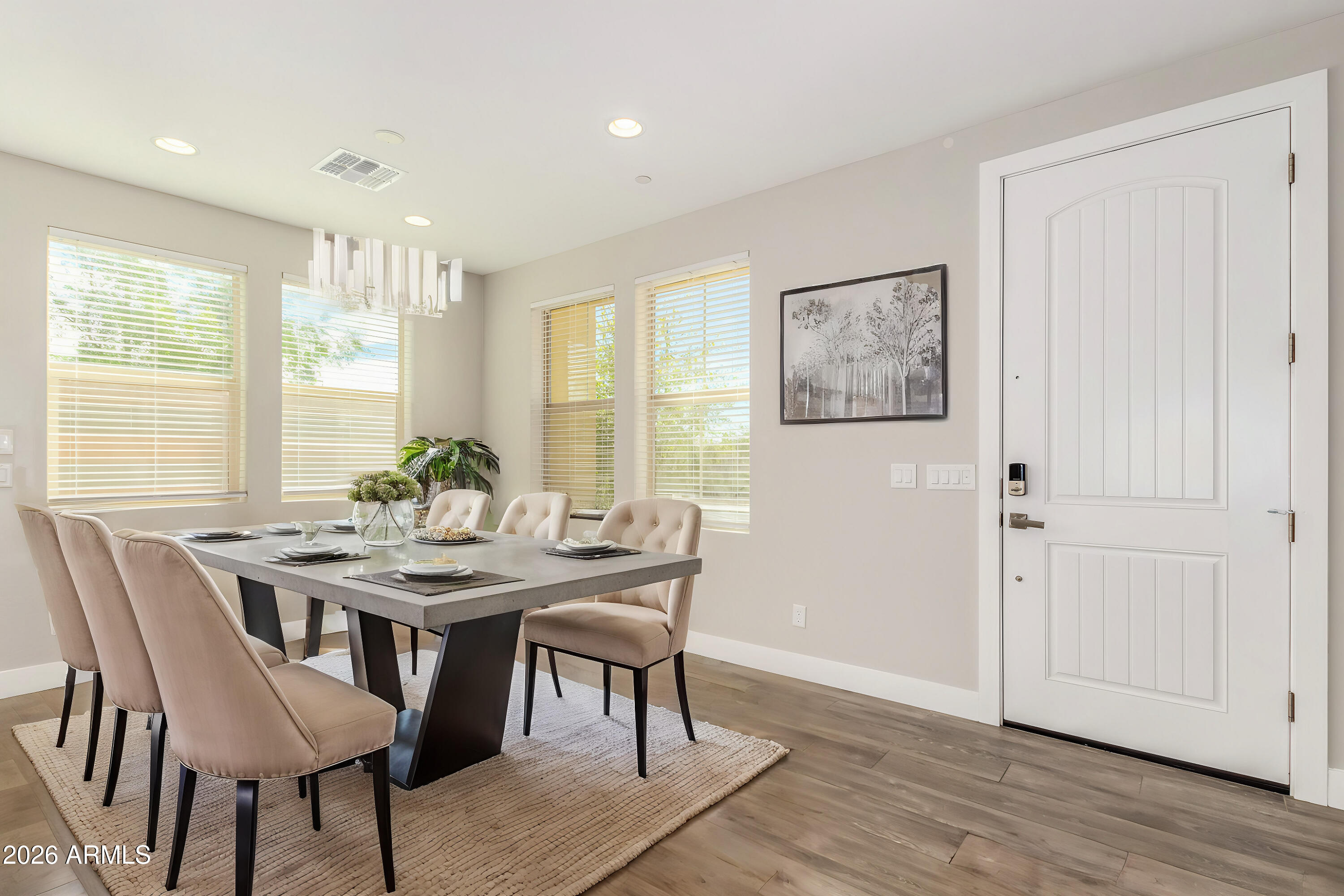 1873 South Follett Way Gilbert, AZ 85295 - Photo 6 of 40 a view of a dining room with furniture window and wooden floor