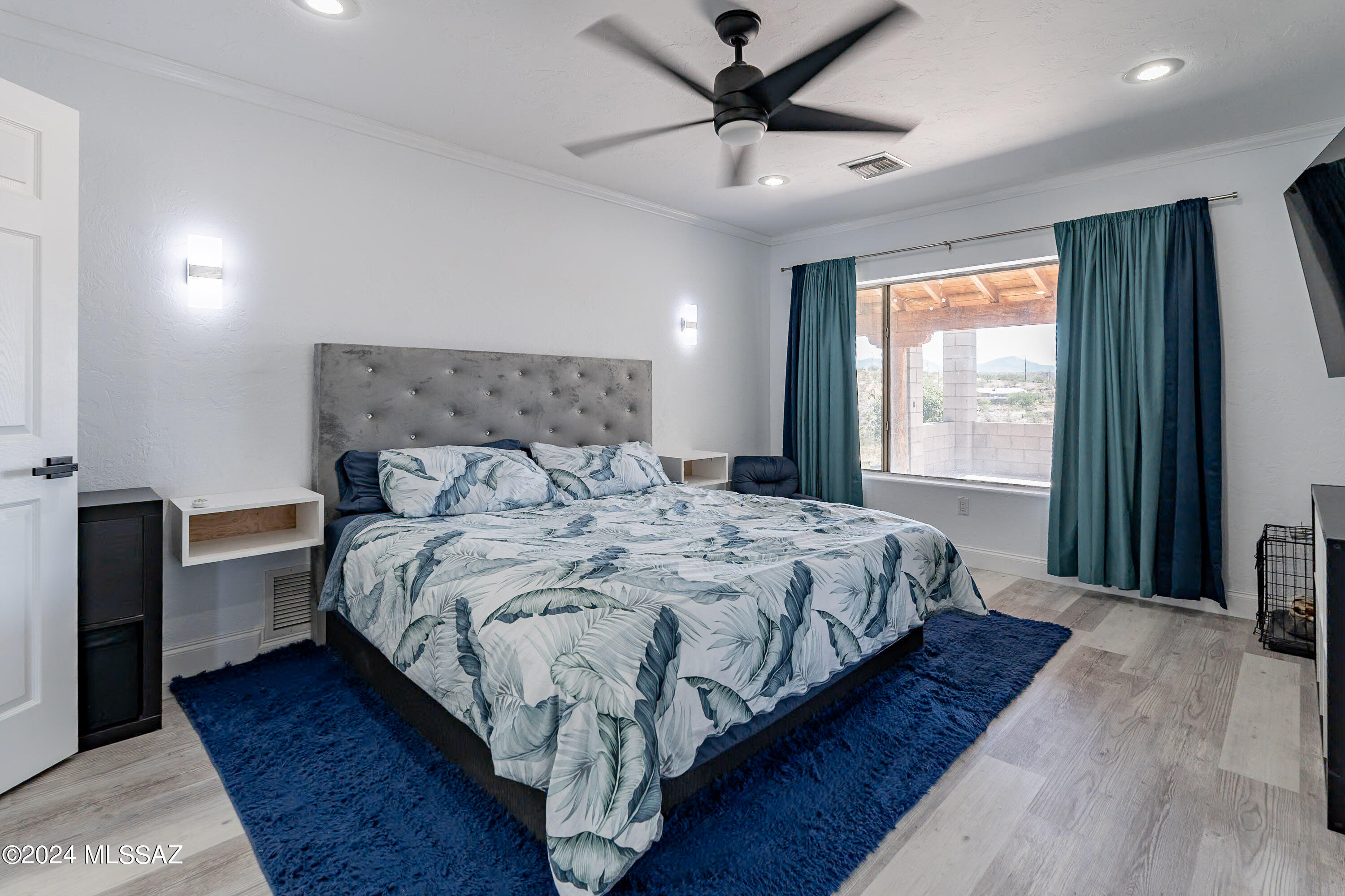 1009 Calle Coyote Rio Rico, AZ 85648 - Photo 11 of 28 a bedroom with bed and window