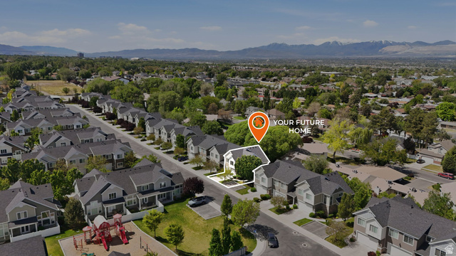 7872 Farm House Lane Midvale, UT 84047 - Photo 35 of 39 Aerial perspective showcasing a residential community with distant mountain ranges
