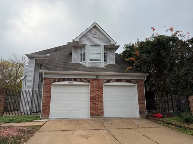 a front view of a house with a garage