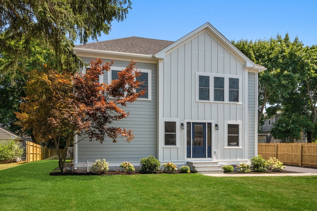 front view of a house with a yard