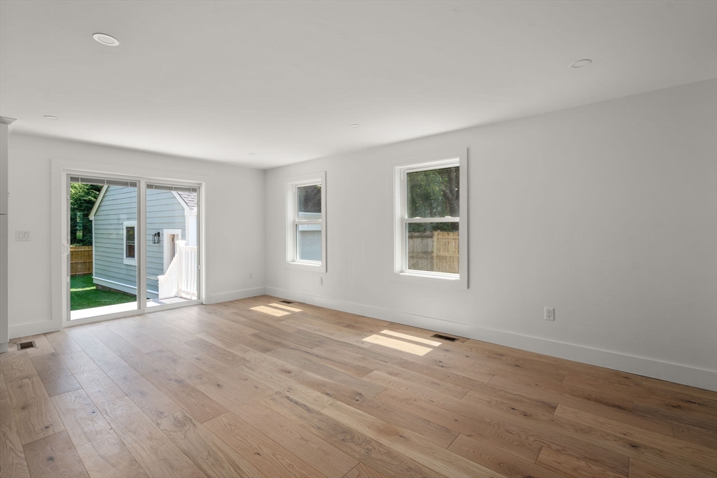 128 Webster Street Needham, MA 02494 - Photo 11 of 30 a view of an empty room with wooden floor and a window