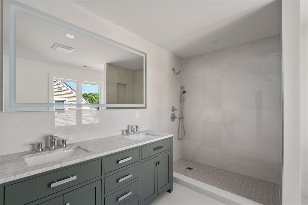 128 Webster Street Needham, MA 02494 - Photo 14 of 30 a bathroom with a granite countertop sink mirror and double