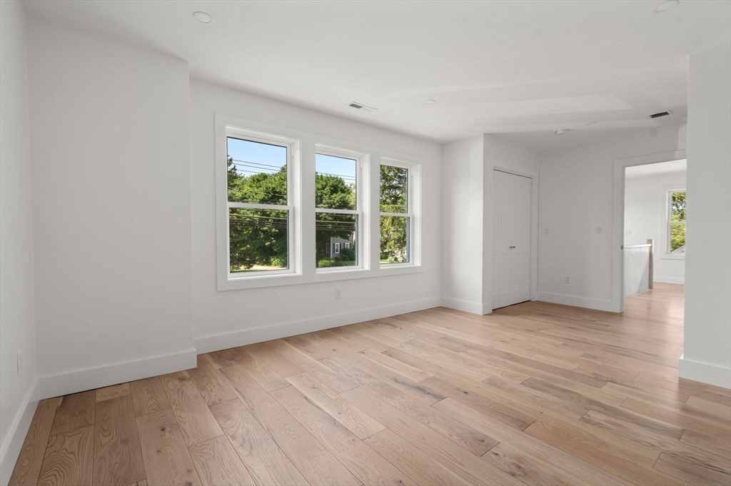 128 Webster Street Needham, MA 02494 - Photo 15 of 30 a view of an empty room with wooden floor and a window