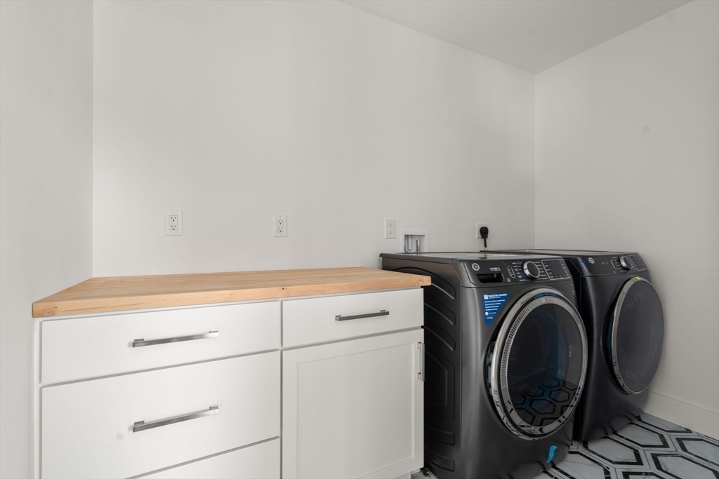 128 Webster Street Needham, MA 02494 - Photo 23 of 30 a utility room with dryer and washer
