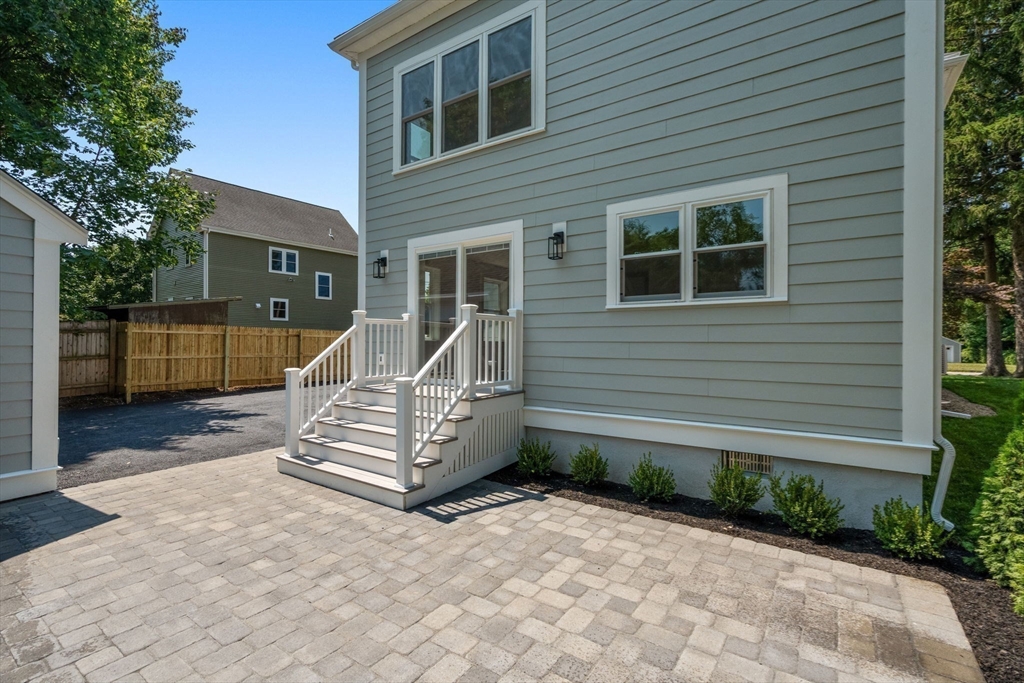 128 Webster Street Needham, MA 02494 - Photo 28 of 30 a front view of a house with a yard