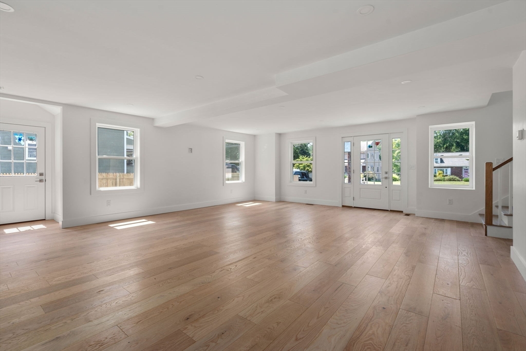 128 Webster Street Needham, MA 02494 - Photo 4 of 30 a view of an empty room with window and wooden floor