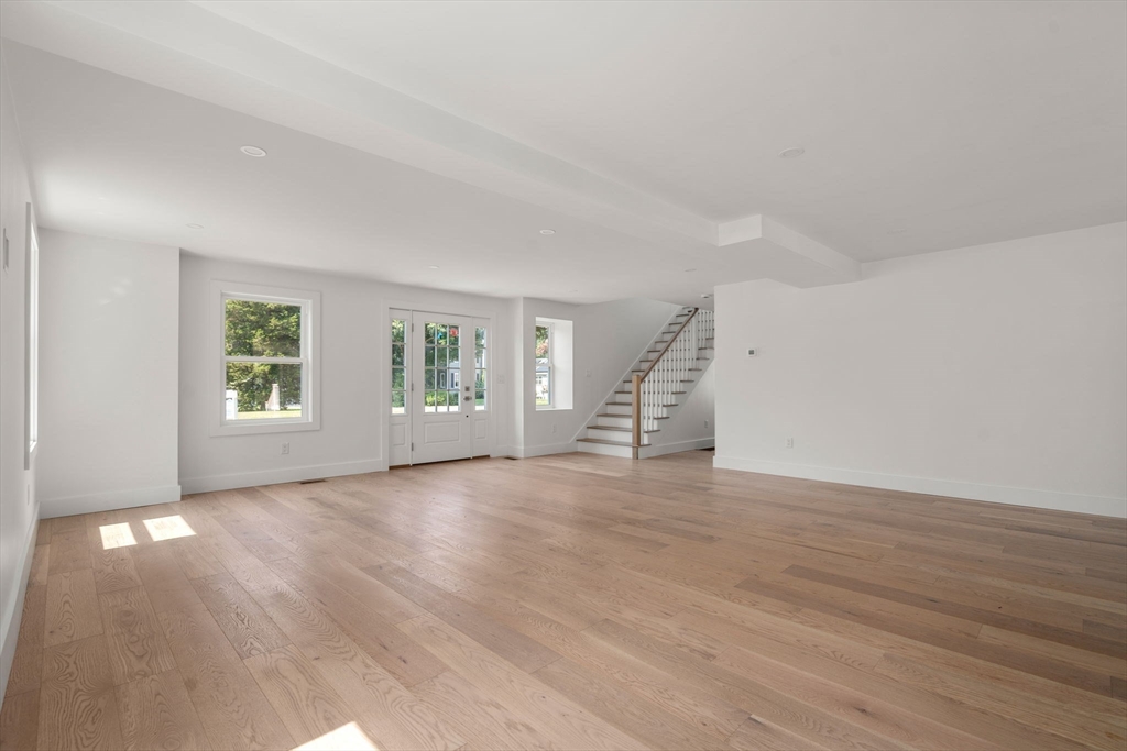 128 Webster Street Needham, MA 02494 - Photo 5 of 30 an empty room with wooden floor and windows