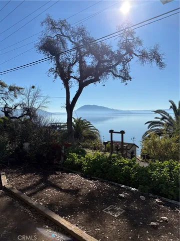 a view of a backyard of the house