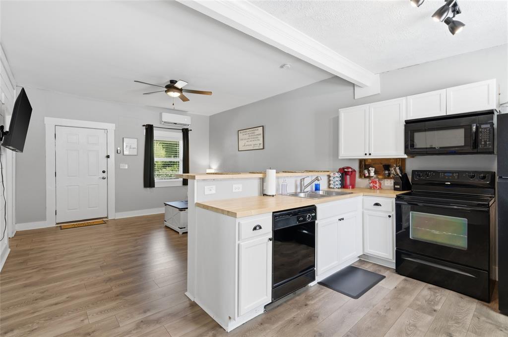 2320 Mistletoe Street Waco, TX 76706 - Photo 4 of 23 a kitchen with a stove oven and a refrigerator