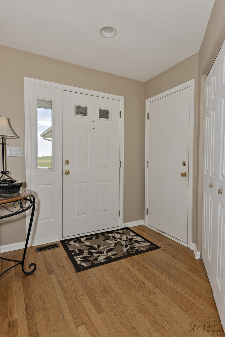 9719 Richardson Road Spring Grove, IL 60081 - Photo 2 of 26 a view of kitchen with refrigerator and window