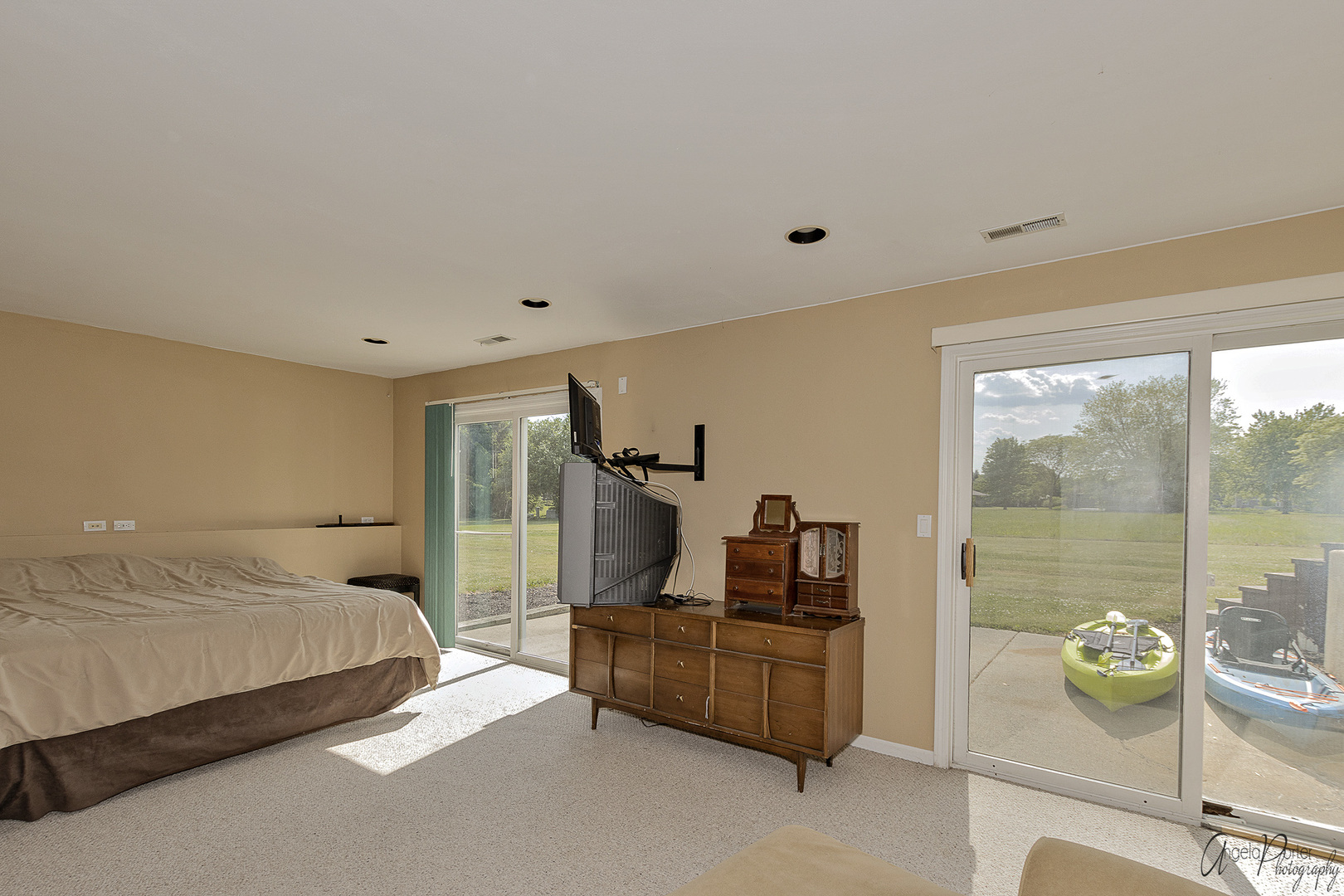 9719 Richardson Road Spring Grove, IL 60081 - Photo 12 of 26 a bedroom with a bed and large windows