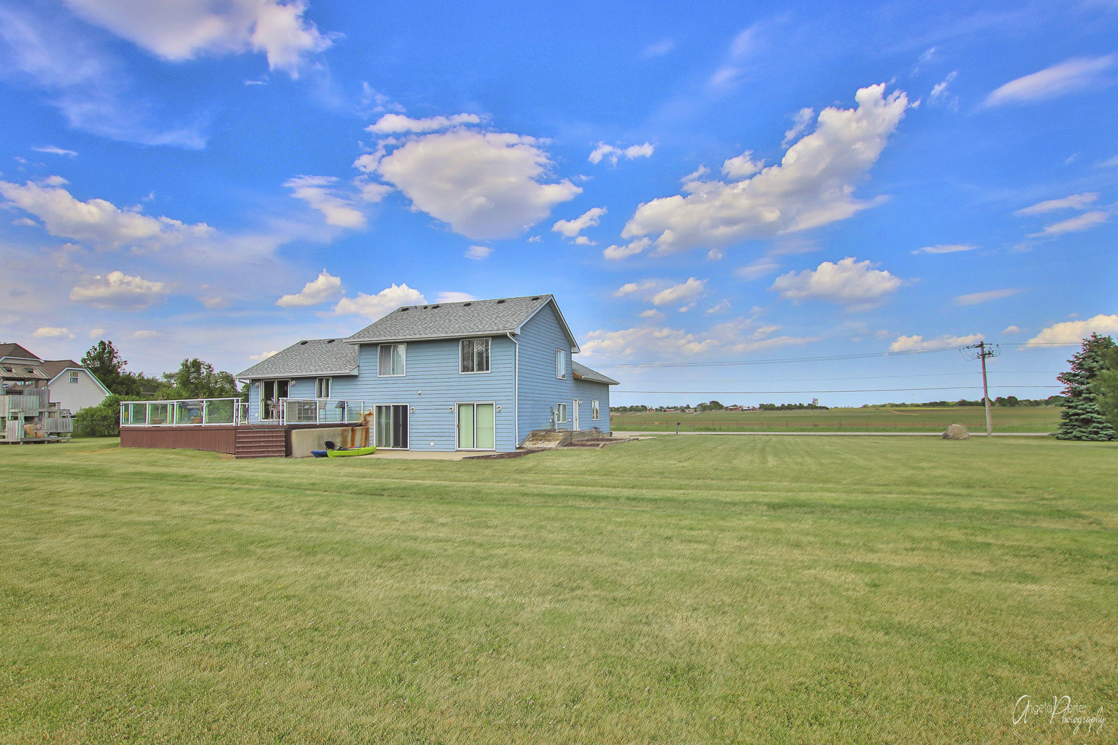 9719 Richardson Road Spring Grove, IL 60081 - Photo 24 of 26 a front view of a house with a big yard