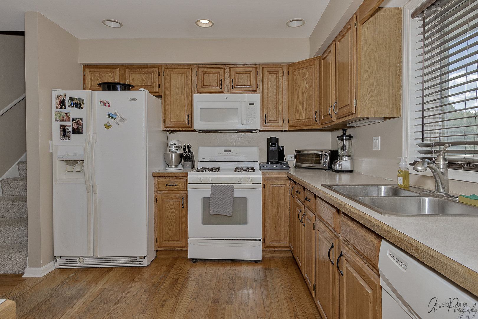 9719 Richardson Road Spring Grove, IL 60081 - Photo 8 of 26 a kitchen with white cabinets and white appliances