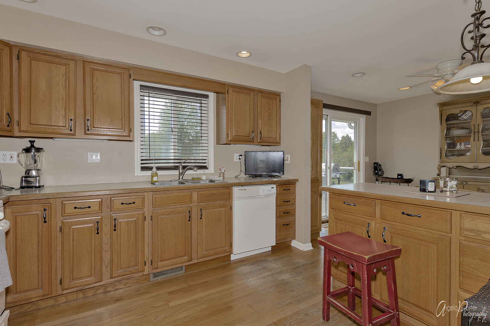 9719 Richardson Road Spring Grove, IL 60081 - Photo 9 of 26 a kitchen with a sink cabinets and window