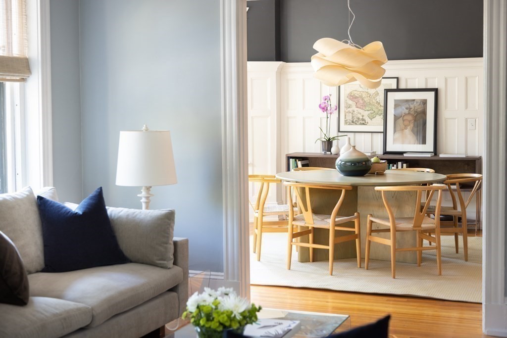 30 Powell Street, Unit 2 Brookline, MA 02446 - Photo 1 of 27 a living room with furniture a flat screen tv and a large window